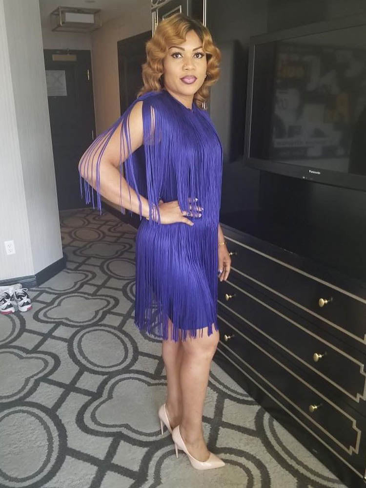 Woman in a purple fringed mini dress