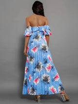 Back view of a woman wearing a blue floral print off-the-shoulder maxi dress with puff sleeves and a pleated skirt.