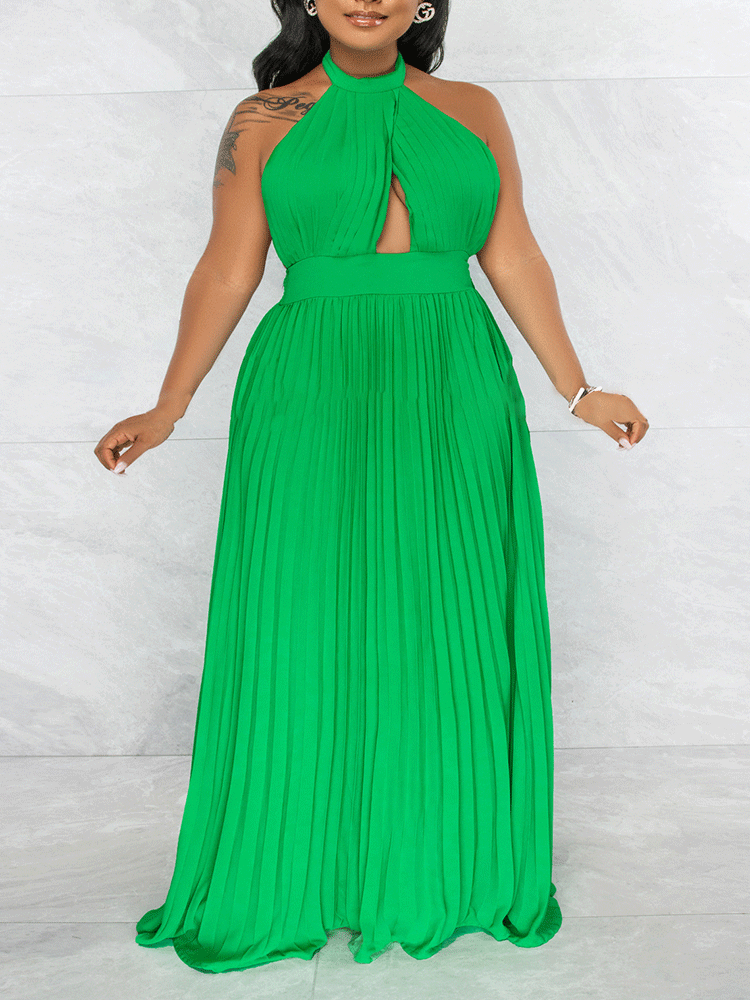 Woman wearing a green halter neck maxi dress with a keyhole cutout and pleated skirt, front view.