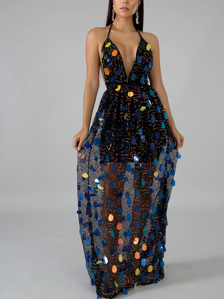 Woman wearing a black sequined maxi dress with a deep V-neck and halter straps.