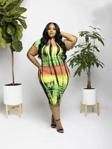 Plus-size woman posing in a tie-dye bodycon dress with short sleeves and a mock neckline.