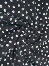 Close-up of the black mesh fabric with scattered rhinestones.