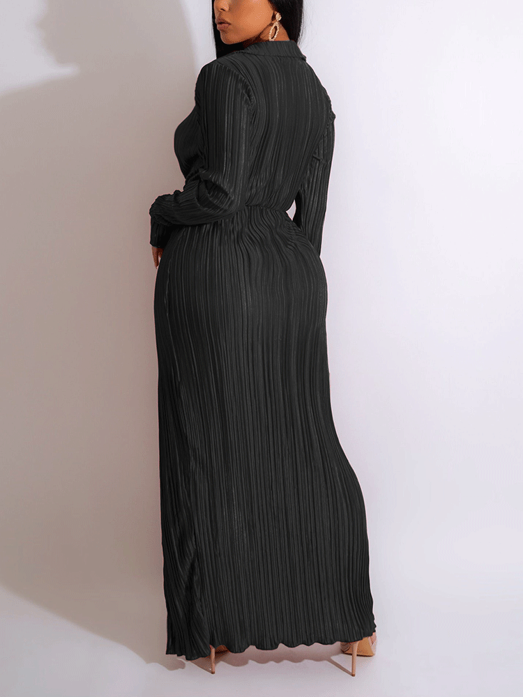 Full-length view of a woman in a red pleated maxi dress, showcasing the wrap-style bodice and high slit.