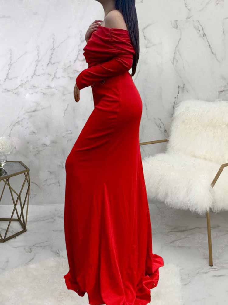 side view of a woman in a red one-shoulder draped long sleeve mermaid formal gown