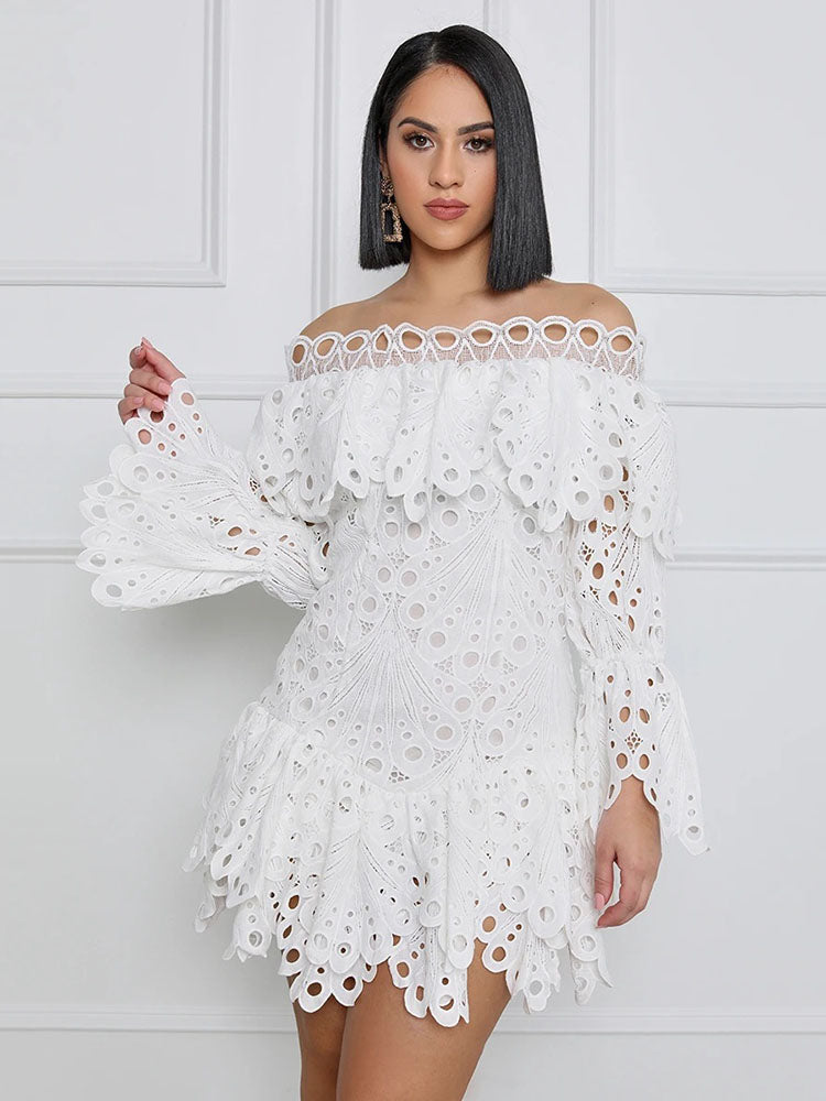 Model wearing a white off-the-shoulder eyelet lace mini dress with bell sleeves and ruffled trim.