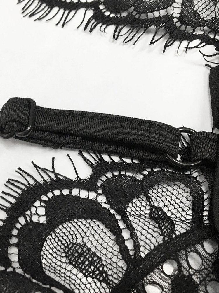 Close-up of the adjustable strap and lace trim on a black dress