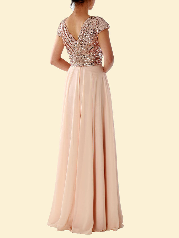 Back view of a woman in a blush pink sequined formal dress