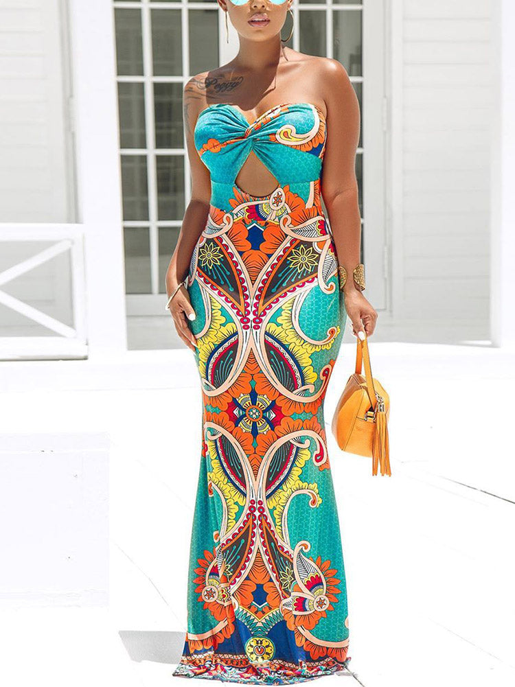 Full-body shot of a woman in a colorful printed strapless maxi dress