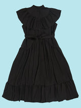 Flat lay of a black maxi dress with ruffled neckline and tiered skirt.