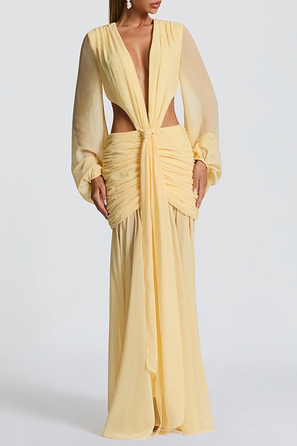 Front view of a yellow maxi dress featuring a knotted V-neckline, side cut-outs, and a gathered waist.