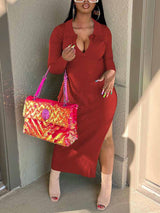 Woman wearing a red ribbed knit midi dress with long sleeves and a v-neck collar, accessorized with a pink sequined handbag and tan heeled boots.