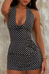 woman in polka dot halter swimsuit