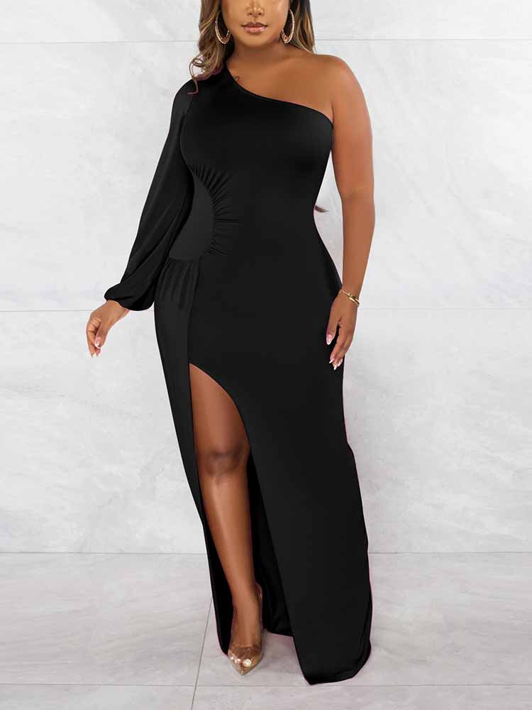 Front view of a woman in a long, black, one-shoulder dress with a high slit.