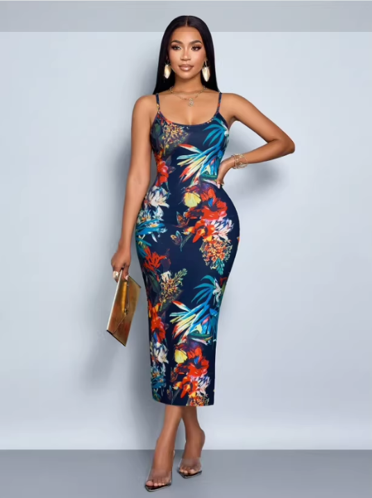 Woman wearing a floral print bodycon midi dress with spaghetti straps and a side slit, holding a gold clutch.