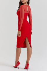 Woman wearing a red sheath dress with sheer illusion neckline and long sleeves, back view