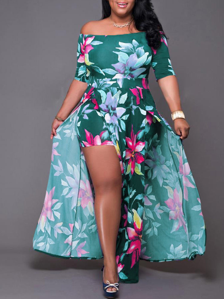 Woman wearing a green floral print off-the-shoulder maxi dress with a high leg slit and integrated shorts.
