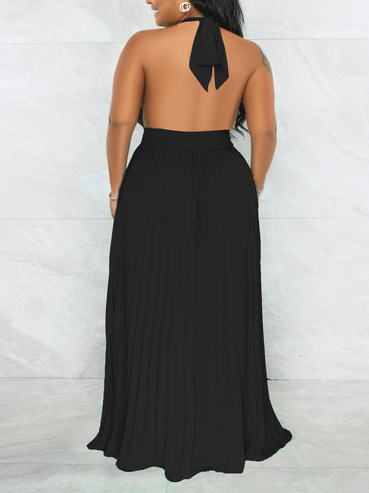 Woman wearing a black halter neck maxi dress with a keyhole cutout and pleated skirt, back view.