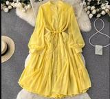 Yellow chiffon tiered midi dress with puffed sleeves and self-tie belt