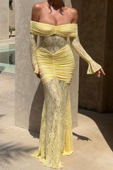 Close-up of a pale yellow off-the-shoulder formal dress with long lace sleeves and ruched detailing, worn by a woman.