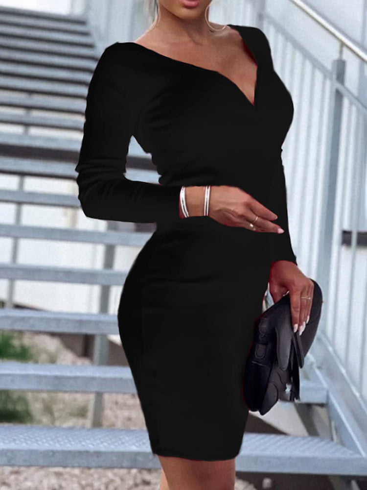 Woman wearing a black long sleeve v-neck bodycon dress