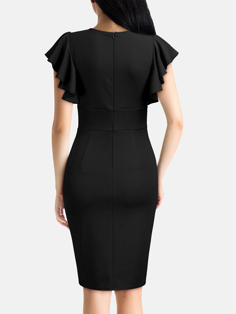 back view of a woman in a black sheath dress with a zipper closure