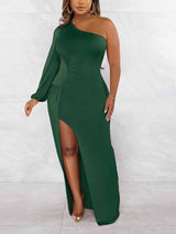 Close-up of the dark green one-shoulder maxi dress, showcasing the fabric and silhouette.