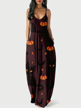 Woman wearing a dark brown maxi dress with a Halloween print featuring black cats and pumpkins.