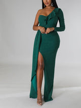 Close-up of the ruffle detail on a green one-shoulder evening gown