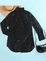 flat lay of a black sequin shirt dress next to a straw hat and a black handbag