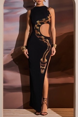 A model poses in a black sleeveless maxi dress with a high neckline, strategic cut-outs, and a bold snake print accentuating the silhouette.