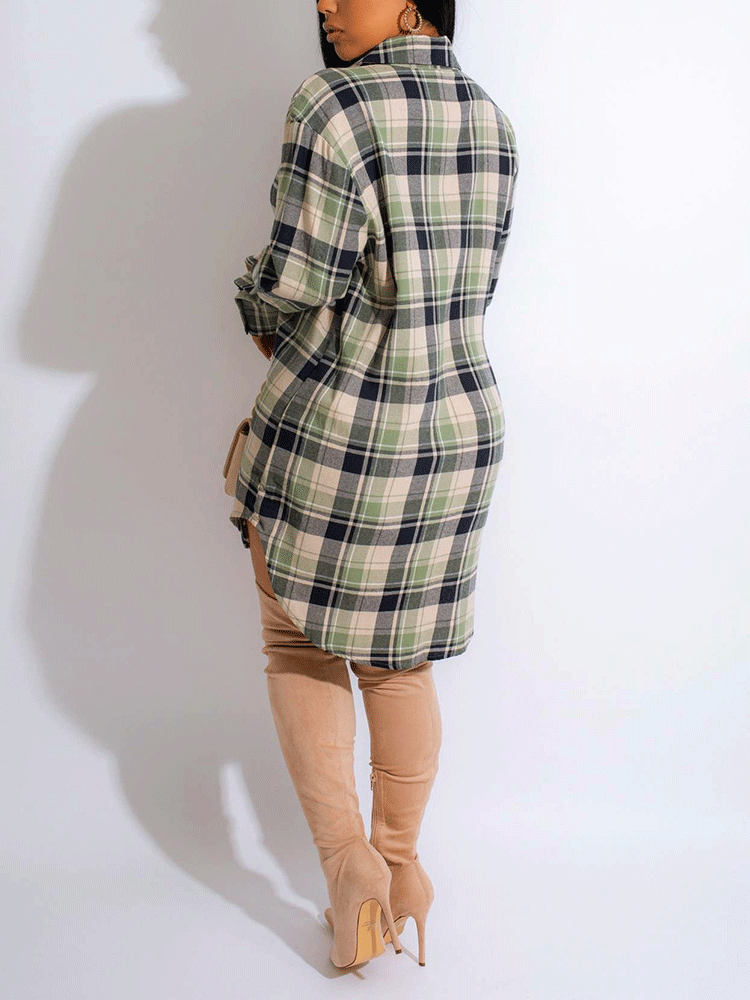 Woman wearing a green and black plaid shirt dress with thigh-high beige boots, back view.