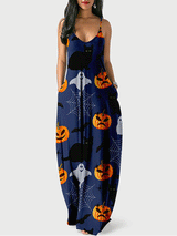 Woman wearing a navy blue maxi dress with a Halloween print featuring pumpkins, black cats, ghosts, and bats.