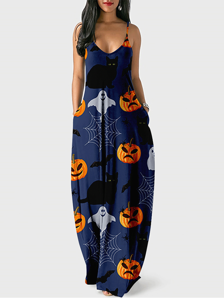 Woman wearing a navy blue maxi dress with a Halloween print featuring pumpkins, black cats, ghosts, and bats.