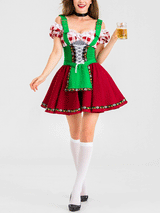 Woman wearing a red and green dirndl-style costume with white knee-high socks and black heels, holding a glass of beer.