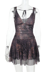 A sheer mesh mini dress with an animal print pattern displayed on a mannequin, featuring a plunging V-neck and a ruched waist.