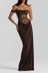 Woman wearing a long, dark brown off-the-shoulder dress with a lace bodice and a draped skirt.
