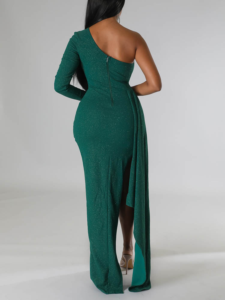 Back view of a green one-shoulder formal dress with a zipper closure and flowing skirt