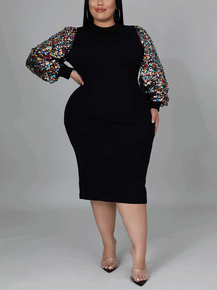 Side profile of a woman wearing a black sheath dress with sequined bishop sleeves and a mock neck.