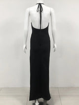 back view of a black floor-length halter dress with an open back and halter straps displayed on a mannequin