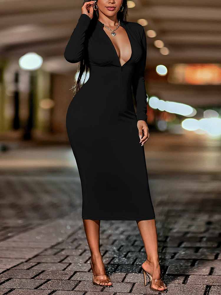 Close-up of a woman in a black ribbed knit midi dress, showcasing the plunging V-neckline and long sleeves.