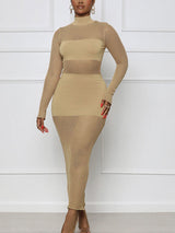 Woman wearing a tan bodycon maxi dress with sheer mesh panels and a mock neck.