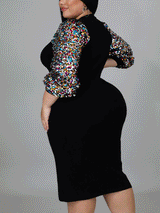 Rear view of a woman showcasing a black sheath dress with sequin-adorned bishop sleeves and a mock neck.
