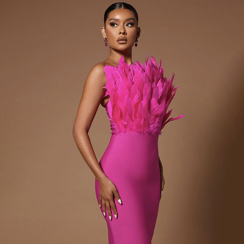 Close-up of the hot pink feather detail on the strapless bodycon dress
