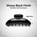 Close-up of a glossy black hair claw clip with high shine