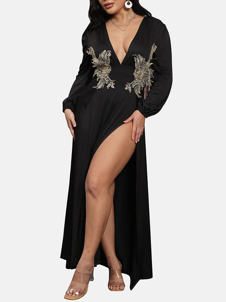 Side view of a woman showcasing the leg slit of a black formal dress.
