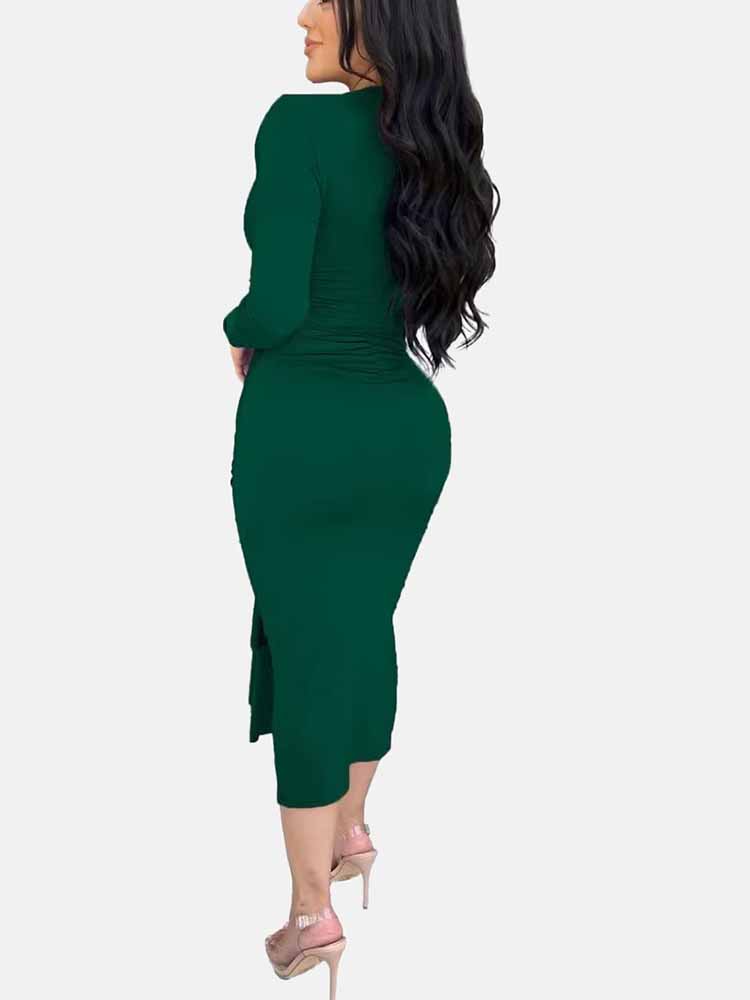 Rear view of a woman wearing a long-sleeved green ruched dress with a slit hem.