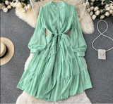 Mint green chiffon tiered midi dress with puffed sleeves and self-tie belt