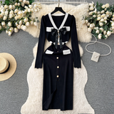Black knit dress with white trim and bow detail