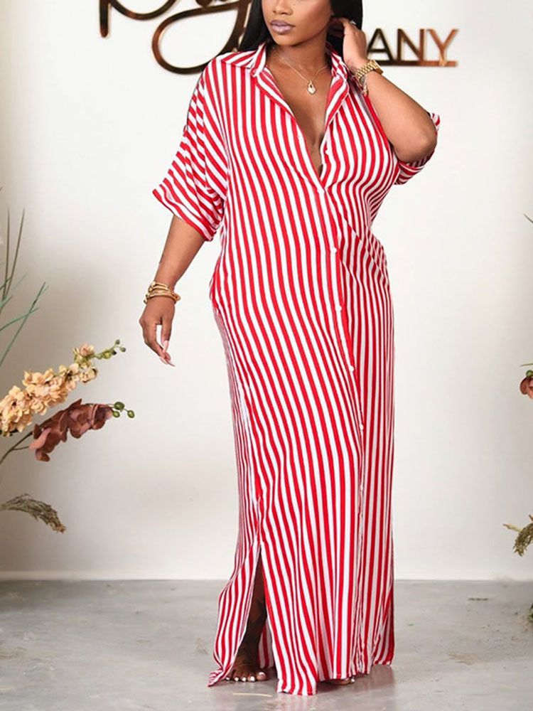 Woman wearing a red and white striped maxi dress with a button-down front and short sleeves.