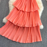 Close-up of coral tiered ruffled skirt